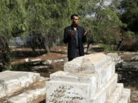 Hatem Abdelkader, an advisor to Palestinian prime minister Salam Fayyad, prays at a Muslim cemetery in Jerusalem on October 30, 2008. Muslim authorities expressed outrage today after the Israeli High Court gave the go-ahead for the construction of a Museum of Tolerance on the site of the Muslim cemetery in Jerusalem. The Mufti of Jerusalem, Sheikh Mohammed Hussein, called the court ruling a 'grave decision' which 'harms the Muslim holy sites.' AFP PHOTO/AHMAD GHARABLI (Photo credit should read AHMAD GHARABLI/AFP/Getty Images)