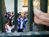 FILE - In this Dec. 30, 2017 file photo, taken by an individual not employed by the Associated Press and obtained by the AP outside Iran, university students attend an anti-government protest inside Tehran University, in Tehran, Iran. As nationwide protests have shaken Iran over the last week, the Islamic Republic increasingly has blamed its foreign foes for fomenting the unrest. So far though, there’s no direct evidence offered by Tehran to support that claim. (AP Photo, File)