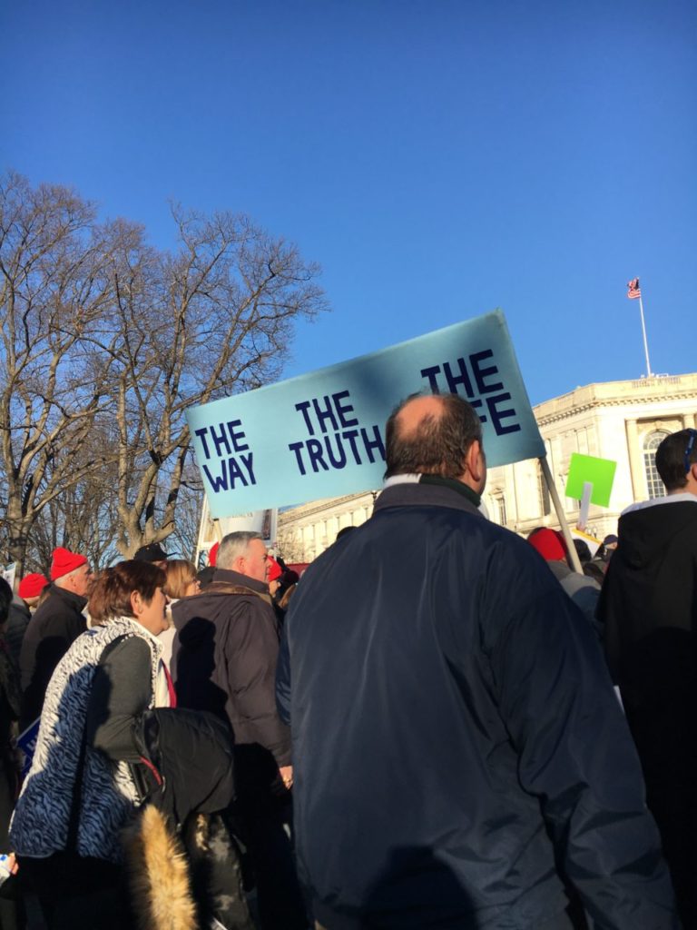 March for Life on January 19, 2018. Marchers carry a sign that reads, 