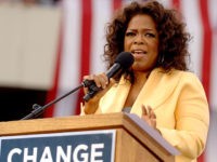 COLUMBIA, SC - DECEMBER 9: Talk show host Oprah Winfrey introduces Democratic presidential hopeful Sen. Barack Obama (D-IL) to a crowd of 29,000 during a campaign event at the William Bryce Football Stadium on December 9, 2007 in Columbia, South Carolina. Obama and Winfrey are scheduled to make one more stop in New Hampshire today. (Photo by Stephen Morton/Getty Images)