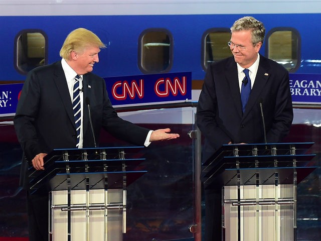 Republican presidential hopefuls, real estate magnate Donald Trump gestures toward former Florida Gov. Jeb Bush (R) during the Republican presidential debate at the Ronald Reagan Presidential Library in Simi Valley, California on September 16, 2015. Republican presidential frontrunner Donald Trump stepped into a campaign hornet's nest as his rivals collectively turned their sights on the billionaire in the party's second debate of the 2016 presidential race. AFP PHOTO / FREDERIC J. BROWN (Photo credit should read FREDERIC J BROWN/AFP/Getty Images)