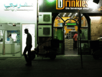 TO GO WITH AFP STORY BY HAITAM EL-TABEI An Egyptian man walks past a shop that sells alcohol in Cairo on May 16, 2013. The Egyptian government doubled taxes on beer to 200 percent and other alcoholic beverages rising from 100 percent to 150 percent. AFP PHOTO/GIANLUIGI GUERCIA (Photo credit should read GIANLUIGI GUERCIA/AFP/Getty Images)