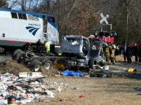 Emergency personnel work at the scene of a train crash involving a garbage truck in Crozet, Va., on Wednesday, Jan. 31, 2018. An Amtrak passenger train carrying dozens of GOP lawmakers to a Republican retreat in West Virginia struck a garbage truck south of Charlottesville, Va. No lawmakers were believed injured. (Zack Wajsgrasu/The Daily Progress via AP)
