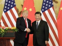 FILE: U.S. President Donald Trump, left, and Xi Jinping, China's president, shake hands during a news conference at the Great Hall of the People in Beijing, China, on Thursday, Nov. 9, 2017. The one year anniversary of U.S. President Donald Trump's inauguration falls on Saturday, January 20, 2018. Our editors select the best archive images looking back over Trumps first year in office. Photographer: Qilai Shen/Bloomberg via Getty Images