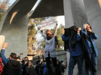 Iranian students protest at the University of Tehran during a demonstration driven by anger over economic problems, in the capital Tehran on December 30, 2017. Students protested in a third day of demonstrations sparked by anger over Iran's economic problems, videos on social media showed, but were outnumbered by counter-demonstrators. / AFP PHOTO / STR (Photo credit should read STR/AFP/Getty Images)