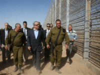 israel border fence Israeli Prime Minister Benjamin Netanyahu walks with IDF Chief of Staff Gadi Eizenkott, left, as they visit the construction work on the fence between Israel and Jordan Tuesday, Feb. 9, 2016. (Marc Israel Sellem, Jerusalem Post, Pool via AP)