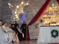 raqis clergymen attend a Christmas mass at the Saint Paul's church on December 24, 2017 in the country's second city Mosul . Hymns filled a church as worshippers celebrated Christmas for the first time in four years after the end of jihadist rule. Tens of thousands of Christians fled northern Iraqi towns in 2014 as the Islamic State group seized Mosul and swathes of the surrounding Nineveh province. / AFP PHOTO / Ahmad MUWAFAQ (Photo credit should read AHMAD MUWAFAQ/AFP/Getty Images)