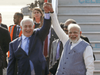 Israel's Prime Minister Benjamin Netanyahu, left, is welcomed by India's Prime Minister Narendra Modi on his arrival at Palam airport in New Delhi Sunday, Jan. 14, 2018. Israeli Prime Minister Netanyahu arrived Sunday for his first visit to India to expand defense, trade and energy ties. (AP Photo)