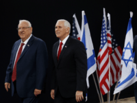 U.S. Vice President Mike Pence, right, walks alongside Israel President Reuven Rivlin during a formal reception ceremony at the President's residence in Jerusalem, Tuesday Jan. 23, 2018. (Ronen Zvulun/Pool via AP)