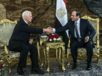 U.S. Vice President Mike Pence shakes hands with Egyptian President Abdel-Fattah el-Sissi, right, at the Presidential Palace in Cairo, Egypt, Saturday, Jan. 20, 2018. Pence arrived in Cairo hours after the U.S. Congress and President Donald Trump failed to reach agreement on a plan to avert a partial federal closure. Pence went ahead with his four-day trip to the Middle East, citing national security and diplomatic reasons. (Khaled Desouki/Pool Photo via AP)