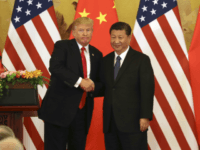 U.S. President Donald Trump (L) and Chinese President Xi Jinping shake hands at a joint news conference held after their meeting in Beijing on Nov. 9, 2017. The two leaders agreed to keep enforcing U.N. sanctions on North Korea until it rids itself of nuclear weapons while pledging to address the billowing U.S. trade deficit with China. (Kyodo) ==Kyodo (Photo by Kyodo News via Getty Images)