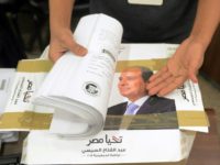 Campaign staff of President Abdel Fattah al-Sisi, who has ruled Egypt with an iron fist since being elected in 2014, check boxes containing signatures needed to register for the March 26-28 election