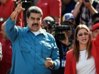 Venezuelan President Nicolas Maduro -- with his wife Cilia Flores at a rally in Caracas on January 23 -- looks to have a clear run for a second term, with the main opposition coalition barred from taking part in the election