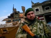Turkish-backed Syrian rebels man a checkpoint in Azaz