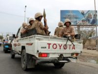 Fighters backing Yemen's southern separatist movement sit in the back of a pick-up truck in the country's second city of Aden on January 28, 2018