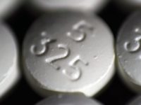 FILE - This Tuesday, Aug. 15, 2017, file photo shows an arrangement of pills of the opioid oxycodone-acetaminophen in New York. Walmart is helping customers get rid of leftover opioids by giving them packets that turn the addictive painkillers into a useless gel. (AP Photo/Patrick Sison, File)