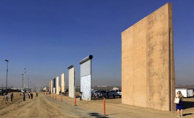 This Oct. 26, 2017 file photo shows prototypes of border walls in San Diego. Rigorous testing of prototypes of President Donald. A U.S. official says recent testing of prototypes of President Donald Trump’s proposed wall with Mexico found their heights should stop border crossers. U.S. tactical teams spent three weeks trying to breach and scale the models in San Diego. An official with direct knowledge of the results said they point to see-through steel barriers topped by concrete as the best design. The official spoke to The Associated Press on condition of anonymity because the information is not authorized for release. (AP Photo/Elliott Spagat, File)