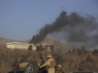 Black smoke rises from the Intercontinental Hotel after an attack in Kabul, Afghanistan, Sunday, Jan. 21, 2018. Gunmen stormed the hotel in the Afghan capital on Saturday evening, triggering a shootout with security forces, officials said. (AP Photo/Rahmat Gul)