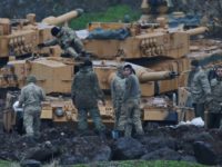 Turkish soldiers prepare their tanks to enter combat and join a military offensive on a Kurdish-held enclave in northern Syria, at a staging area in the Hatay province,Turkey near the the border with Syria.Turkey launched an operation, codenamed Olive Branch, last week against the Syrian Kurdish People's Protection Units in Afrin, Syria that it deems a terror group. The operation codenamed Olive Branch is on its fourth day. (AP Photo/Lefteris Pitarakis)