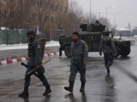 Afghan security personnel arrive at the site of an attack at the Marshal Fahim academy in Kabul, Afghanistan Monday, Jan. 29, 2018. An Afghan official and an eyewitness say blasts have been heard and a gunbattle is occurring near the military academy in the capital Kabul. (AP Photo/Rahmat Gul)