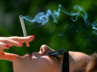 ILLUSTRATION - a woman is smoking a cigarette, Germany, city of Seesen, 06. June 2016. Photo by: Frank May/picture-alliance/dpa/AP Images