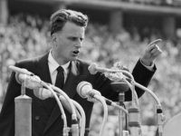 American evangelist Billy Graham speaks to over 100,000 Berliners at the Olympic Stadium in Germany, June 27, 1954. (AP Photo)