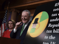 Senate Minority Leader Sen. Chuck Schumer of N.Y., right, standing with House Minority Leader Nancy Pelosi of Calif., speaks at a news conference on Capitol Hill in Washington, Wednesday, Dec. 20, 2017, on the passage of legislation that overhauls U.S. tax law. The massive $1.5 trillion tax package affects everyone's taxes but is dominated by breaks for business and higher earners. Democrats call the legislation a boon to the rich that leaves middle-class and working Americans behind. (AP Photo/Susan Walsh)