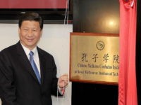 China's Vice President Xi Jinping unveils the plaque at the opening of Australia's first Chinese Medicine Confucius Institute at the RMIT University in Melbourne on June 20, 2010. The Confucius Institute will promote the study of Chinese culture and language with a focus on Chinese Medicine - one of the world's oldest and longest standing healthcare systems, tracing back more than 2,500 years. Xi is on a five-day visit to Australia. AFP PHOTO/William WEST (Photo credit should read WILLIAM WEST/AFP/Getty Images)