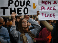 Protesters hold banners during a demonstration against police brutality on February 18, 2017 on the place de la Republique in Paris, following the alleged rape of a black youth, identified only as Theo, with a police baton, an incident that has sparked 10 nights of rioting and more than 200 arrests. The injuries sustained by Theo during a stop-and-search operation on February 2 in the suburb of Aulnay-sous-Bois, has revived long-simmering frustrations over policing in immigrant communities, where young men accuse the police of repeatedly targeting them in aggressive stop-and-search operations and using excessive force during arrests. / AFP / Lionel BONAVENTURE (Photo credit should read LIONEL BONAVENTURE/AFP/Getty Images)