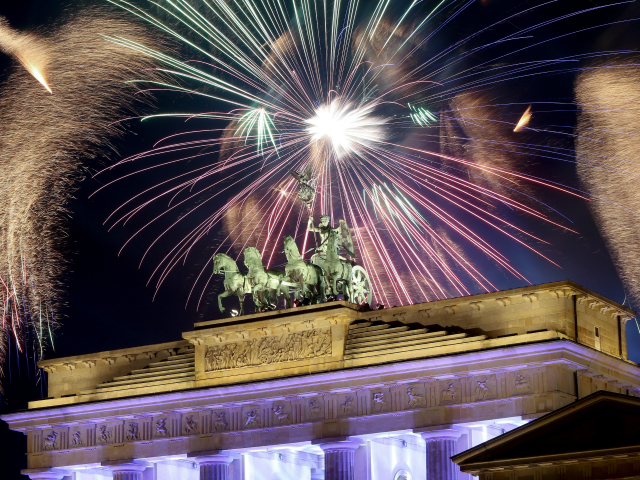 Fireworks explode over the Brandenburg Gate during New Year's festivities on January 1, 2018 in Berlin, Germany.