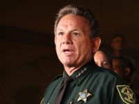 PARKLAND, FL - FEBRUARY 14: Scott Israel, Sheriff of Broward County, (L) and Florida Governor Rick Scott speak to the media as they visit Marjory Stoneman Douglas High School after a shooting at the school killed 17 people on February 14, 2018 in Parkland, Florida. Numerous law enforcement officials continue to investigate the scene. (Photo by Joe Raedle/Getty Images)