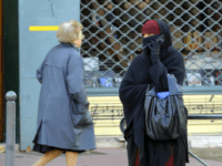 A woman wearing a niqab, the islamic full veil, gives a phone call in a street of Lyon, eastern France, on January 25, 2010. A ban on the wearing of the full Islamic veil is being studied in several European countries, including the Netherlands, Denmark and Austria. In France a parliamentary commission is due to present a much-awaited report on January 26, 2010, which is expected to recommend that new legislation be enacted to ban the full veil, known as the burqa or niqab, in public places. AFP PHOTO/PHILIPPE DESMAZES (Photo credit should read PHILIPPE DESMAZES/AFP/Getty Images)