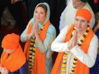 Canadian Prime Minister Justin Trudeau (R) along with his wife Sophie Gregoire (L) pay their respects at the SSikh Golden Temple in Amritsar on February 21, 2018. Trudeau and his family are on a week-long official trip to India. / AFP PHOTO / NARINDER NANU (Photo credit should read NARINDER NANU/AFP/Getty Images)