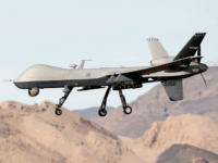 An MQ-9 Reaper remotely piloted aircraft (RPA) flies by during a training mission at Creech Air Force Base on November 17, 2015 in Indian Springs, Nevada. The Pentagon has plans to expand combat air patrols flights by remotely piloted aircraft by as much as 50 percent over the next few years to meet an increased need for surveillance, reconnaissance and lethal airstrikes in more areas around the world. (Photo by Isaac Brekken/Getty Images)