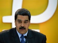 Venezuela's President Nicolas Maduro delivers a speach during a press conference to launch to the market a new oil-backed cryptocurrency called 'Petro', at the Miraflores Presidential Palace in Caracas, on February 20, 2018. Venezuela formally launched its new oil-backed cryptocurrency on Tuesday in an unconventional bid to haul itself out of a deepening economic crisis. The leftist Caracas government put 38.4 million units of the world's first state-backed digital currency, the Petro, on private pre-sale from the early hours. A total of 100 million Petros will go on sale, with an initial value set at $60, based on the price of a barrel of Venezuelan crude in mid-January. / AFP PHOTO / Federico PARRA (Photo credit should read FEDERICO PARRA/AFP/Getty Images)