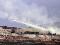 Turkish artillery fires toward Syrian Kurdish positions in Afrin area, Syria, from Turkish side of the border in Hatay, Turkey, Friday, Feb. 9, 2018. Turkish jets have resumed airstrikes in the Syrian Kurdish-run enclave of Afrin after a brief lull killing and wounding several people, the military and media reports said Friday.(AP Photo)