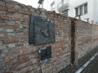 A fragment of the former Warsaw Ghetto wall in Sienna 53 street that regional official for preservation of historical sites wants put on a list of protected historical monuments, in Warsaw, Poland, Tuesday, Feb. 20, 2018. The wall was built in 1940, when the Nazi Germans closed the area of Warsaw they called the “Jewish district.” (AP Photo/Czarek Sokolowski)