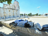 Women lay prostrate in prayer for victims of the January 12, 2010 Haiti earthquake near the destroyed Cathedral of Port-au-Prince on January 12, 2013. Three years after a massive earthquake ravaged Haiti, President Michel Martelly said the country was slowly rebuilding, despite the ongoing day-to-day misery of many survivors. An estimated 250,000 people were killed in the January 12, 2010 earthquake. Hundreds of thousands are still living rough in squalid makeshift camps, and they now face rampant crime, a cholera outbreak and the occasional hurricane.during memorial day in honor of the victims of the last quake of January 12 2013 in Haiti.People put photo of parent and friend victims of the quake.