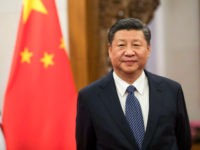 Xi Jinping, China's president, waits to greet Theresa May, U.K. prime minister, ahead of their bilateral meeting at the Diaoyutai State Guest House in Beijing, China, on Thursday, Feb. 1, 2018. May is leading the largest business delegation her government has ever taken overseas as she seeks to put her Brexit troubles aside and make progress on boosting U.K. trade. Photographer: Chris Ratcliffe/Bloomberg via Getty Images