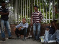 CUCUTA, COLOMBIA - FEBRUARY 22: Venezuelans trying to survive and escape from their country crisis, wait for receiving food at a charity churches in Colombian-Venezuelan Border Town, Cucuta, Colombia on February 22, 2018. In the past two months there is a group of Venezuelans sleep on the garbage-strewn streets of Cucuta and get a free meals everyday in charity. Though they are in terrible situation, they have no desire to return home to Venezuela. For them, adapting to life in a new country seems more attractive than the hunger and upheaval in their country. Inflation last year surpassed 2,600 percent, according to opposition lawmakers, and there is severe shortages of food and medicine in Venezuela. (Photo by Juancho Torres/Anadolu Agency/Getty Images)