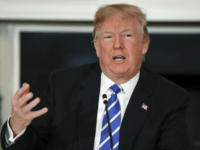 President Donald Trump speaks in the State Dining Room of the White House in Washington, Monday, Feb. 12, 2018, during a meeting with state and local officials about infrastructure. (AP Photo/Carolyn Kaster)