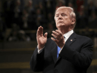 President Donald Trump claps during the State of the Union address in the House chamber of the U.S. Capitol to a joint session of Congress Tuesday, Jan. 30, 2018 in Washington. (Win McNamee/Pool via AP)