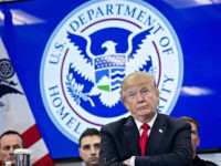 U.S. President Donald Trump listens during a Customs and Border Protection (CBP) roundtable discussion after touring the CBP National Targeting Center in Sterling, Virginia, U.S., on Friday, Feb. 2, 2018. Trump is looking to ratchet up pressure on lawmakers to consider the immigration proposal he unveiled in Tuesday's State of the Union using the visit as an opportunity to again argue his proposal would bolster the country's borders. Photographer: Andrew Harrer/Bloomberg via Getty Images