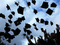 Students throw their mortarboards in the air during their graduation photograph at the University of Birmingham degree congregations on July 14, 2009 in Birmingham, England