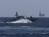 An Israeli Navy vessel passes by the Tamar drilling natural gas production platform during a squadron exercise on May 27, 2013 off the coast of Israel in the Mediterranean Sea. Israel launched a nation-wide exercise today to test the civilian population's response to a possible massive rocket attack from three fronts. (Photo by Uriel Sinai/Getty Images)