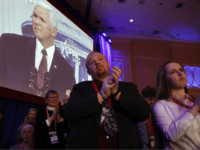 Attendees applaud Vice President Mike Pence as he speaks at the Conservative Political Action Conference (CPAC), at National Harbor, Md., Thursday, Feb. 22, 2018. (AP Photo/Jacquelyn Martin)