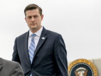 President Donald Trump's Chief of Staff John Kelly, left, White House chief economic adviser Gary Cohn, center, and White House Staff Secretary Rob Porter, right, arrive at Andrews Air Force Base, Md., Thursday, Feb. 1, 2018, for a short trip to the White House after accompanying President Donald Trump at the 2018 House and Senate Republican Member Conference at The Greenbrier in White Sulphur Springs, WVa. (AP Photo/Andrew Harnik)