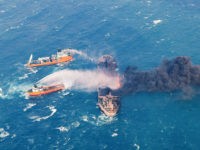 FILE - In this Wednesday, Jan. 10, 2018, photo provided by China's Ministry of Transport, firefighting boats work to put on a blaze on the oil tanker Sanchi in the East China Sea off the eastern coast of China. A Chinese official said Friday, Jan. 19, 2018, that the explosion and sinking of an Iranian oil tanker in the East China Sea was without precedent, creating enormous difficulties for rescue and recovery efforts. (Ministry of Transport via AP, File)