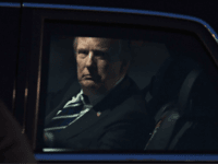 US President Donald Trump looks on from the presidential limo, nicknamed The Beast, following his arrival at Hanoi's Noi Bai airport on November 11, 2017. Trump arrived in the Vietnamese capital after attending the Asia-Pacific Economic Cooperation (APEC) Summit leaders meetings earlier in the day in Danang. / AFP PHOTO / HOANG DINH NAM (Photo credit should read HOANG DINH NAM/AFP/Getty Images)