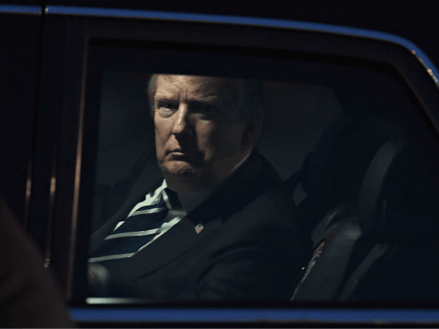 US President Donald Trump looks on from the presidential limo, nicknamed The Beast, following his arrival at Hanoi's Noi Bai airport on November 11, 2017. Trump arrived in the Vietnamese capital after attending the Asia-Pacific Economic Cooperation (APEC) Summit leaders meetings earlier in the day in Danang. / AFP PHOTO / HOANG DINH NAM (Photo credit should read HOANG DINH NAM/AFP/Getty Images)